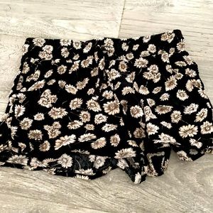 Black shorts with a floral print and elastic band